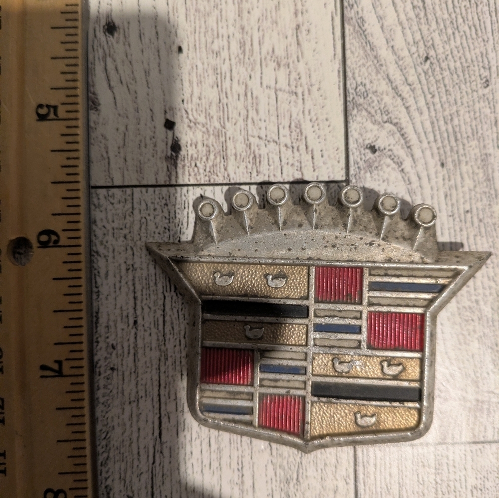 Cadillac Silver and Red Car Emblem